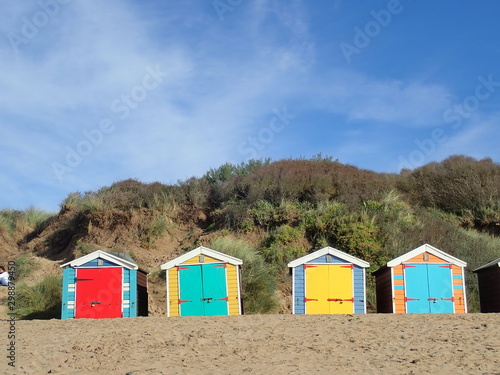 Colourful beach huts at Saunton © Holidays from Hels