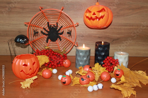 pumpkins and candles on black background