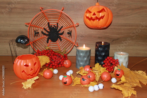 pumpkins and candles on black background