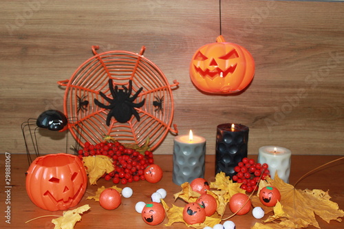 halloween pumpkins and candles on wooden background