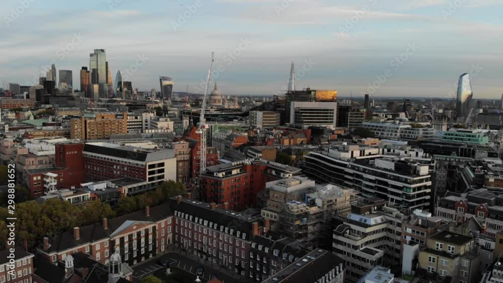 Aerial view of Central London at sunset flying towards St Pauls Cathedral, The Shard, The Cheese grater, Walkie Talkie and The Scalpel buildings Aerial view of Central London at sunset flying towards St Pauls Cathedral, The Shard, The Cheese grater, Walkie Talkie and The Scalpel buildings