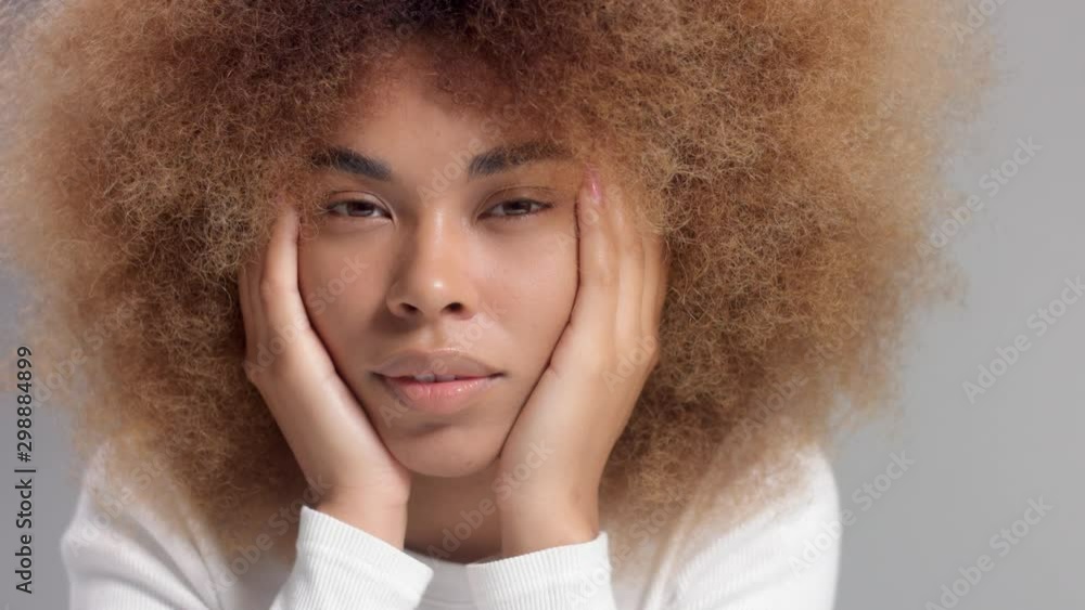 Mixed race black woman with face rest on hands portrait Mixed race black woman with face rest on hands portrait