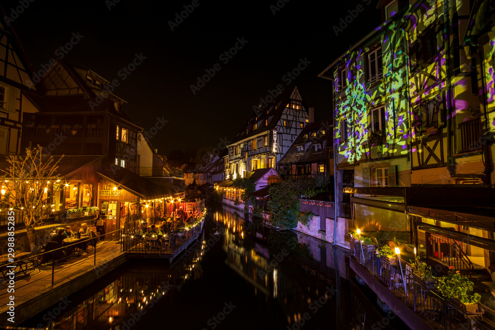 Beautiful night view in Petite Venice with water canal and traditional half timbered houses, Colmar, Alsace, France
