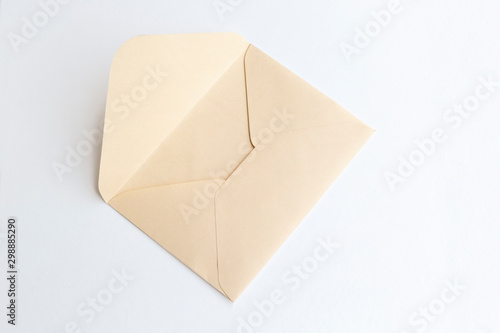 Blank paper blue envelope, letter for mail on white background, flat lay, top view. Concept postal service or greeting card