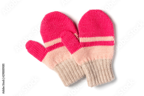 Red and beige knitted baby mittens isolated on a white background, top view. Winter clothes.