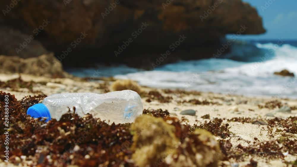 Plastic bottle washed up on tropical beach Plastic bottle washed up on tropical beach