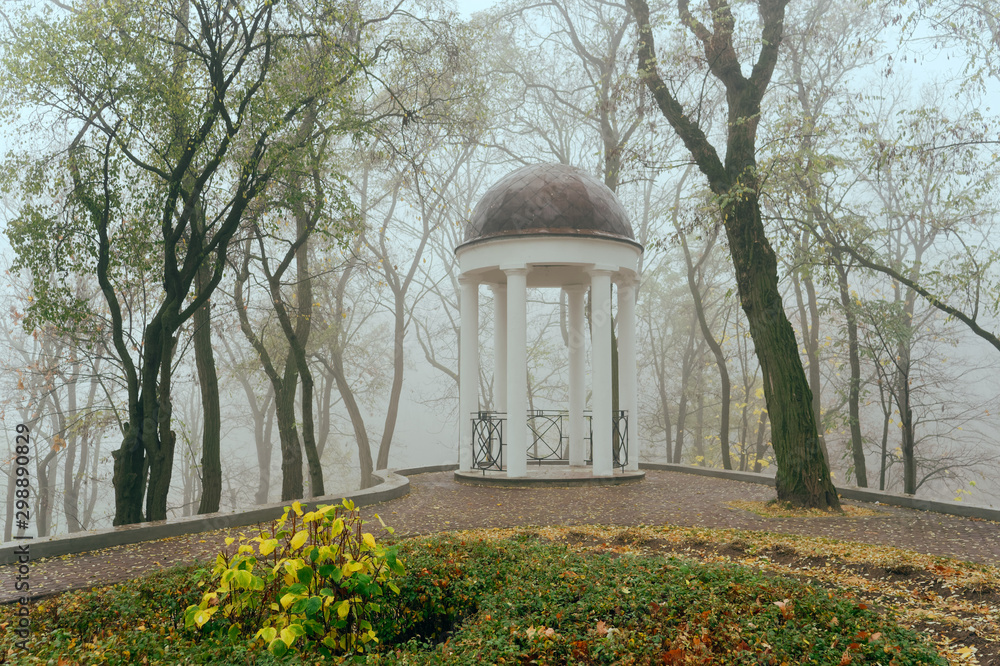 Obraz premium White arbor in the fog in the fall. Gomel, Belarus