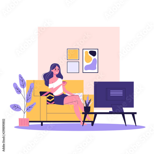 Happy woman sitting on the sofa and watch TV show. Comfortable couch
