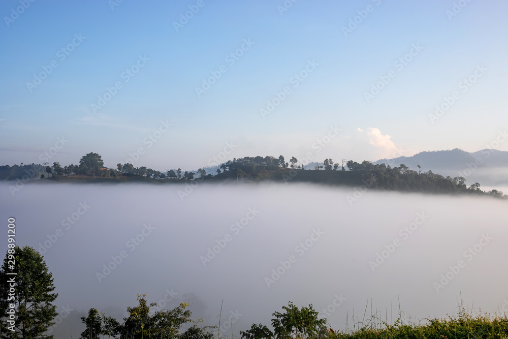 View of mountains covered in foggy during morning sunrise. View of mountains covered in foggy during morning sunrise.