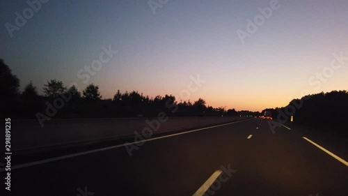 POV video footage 4k of car driving on motorway in Southern France, Europe, at dusk