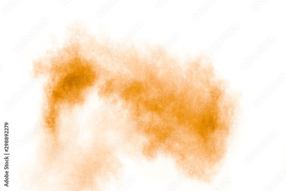 Abstract light orange powder explosion on white background.Freeze motion of light orange dust particles splash. Abstract light orange powder explosion on white background.Freeze motion of light orange dust particles splash.