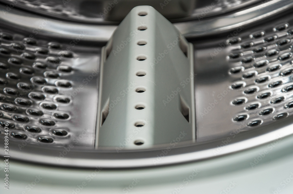 Plastic rib in the drum of the side loading washing machine. Rib for high-quality washing and washing machine efficiency. Plastic rib in the drum of the side loading washing machine. Rib for high-quality washing and washing machine efficiency.