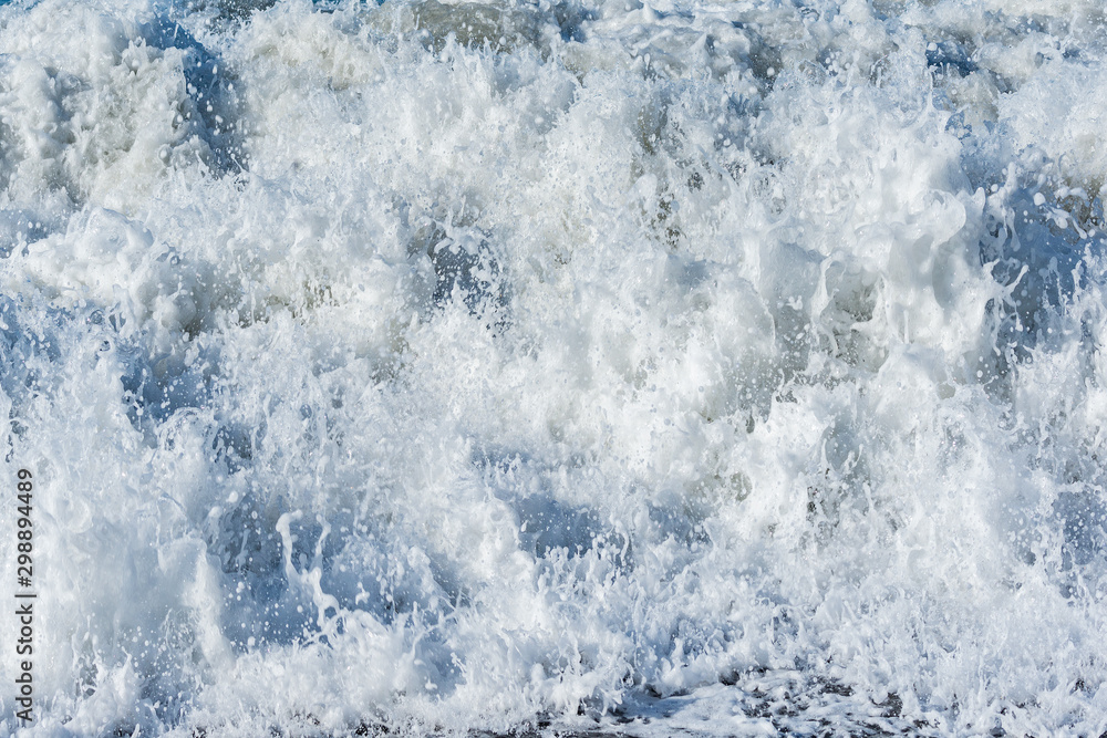 Drops and splash of the sea wave at sunny day time. Drops and splash of the sea wave at sunny day time.