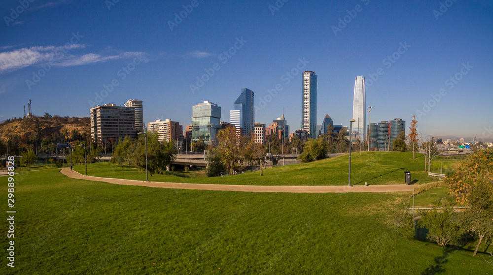 Fototapeta premium Aerial view of road jungtion and Manquehue hill from Vitacura bicentennial park on a clear day in Chilean capital Santiago