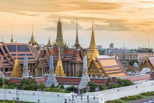 Wat Phra Kaew or Temple of the Emerald Buddhath and The Grand Palace at sunset in Bangkok Thailand. Wat Pra Kaew is a Buddhist temple, Wat Pra Kaew is among the best known of Thailand's landmarks. © Phutthiseth