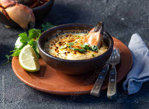  CHILEAN FOOD.  Baked crabmeat crab meat with cheese, cream and bread.  Traditional dish of chilean coast. Pastel o chupe de jaiba. photo