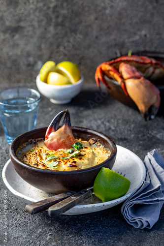  CHILEAN FOOD.  Baked crabmeat crab meat with cheese, cream and bread.  Traditional dish of chilean coast. Pastel o chupe de jaiba. photo