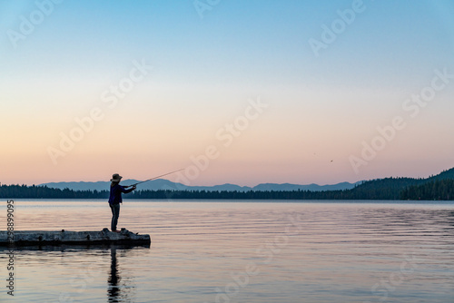 Woman Fishing in Lake Tahoe During Sunset