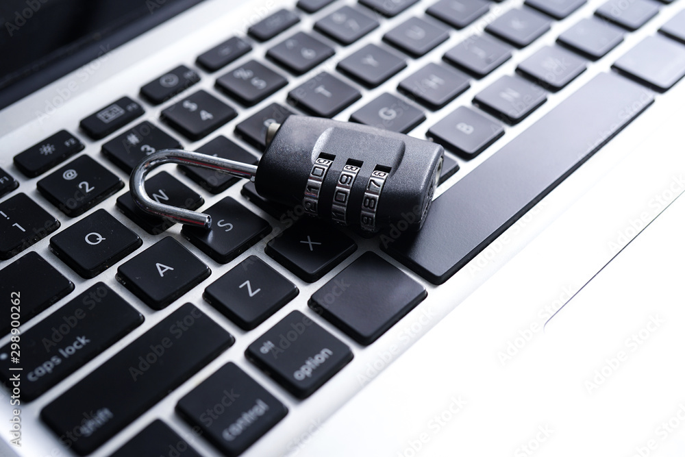 Padlock lying on keyboard symbolizing Computer Cyber Security Concept Padlock lying on keyboard symbolizing Computer Cyber Security Concept