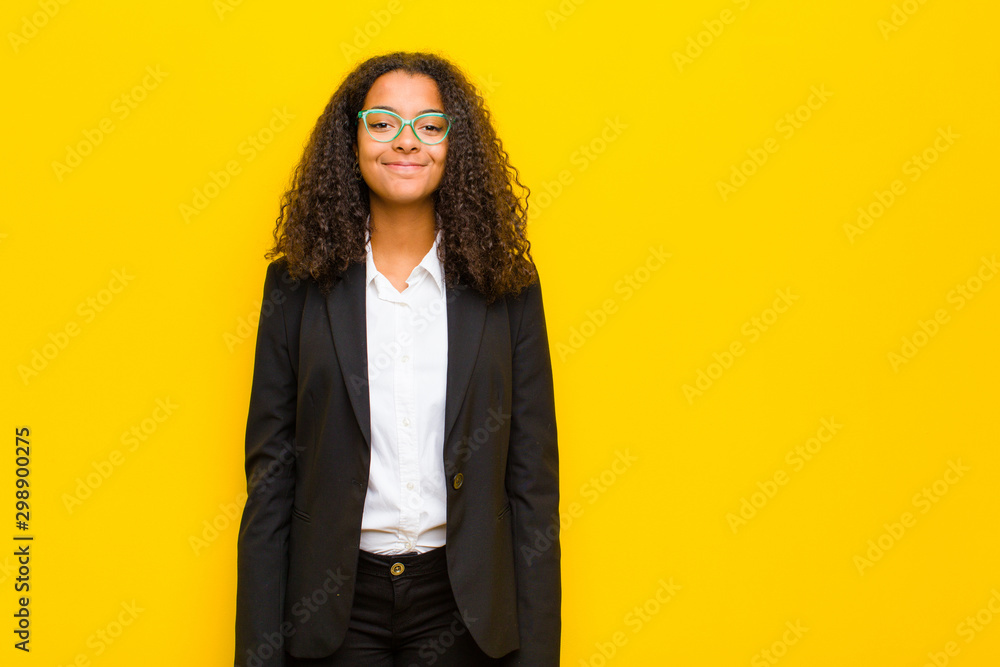 Φωτογραφία black business woman smiling positively and confidently, looking satisfied, frie