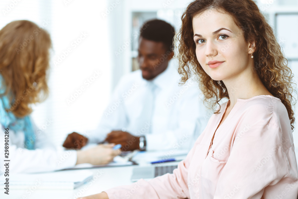 Business woman at meeting in office, colored in white. Multi ethnic business people group Business woman at meeting in office, colored in white. Multi ethnic business people group