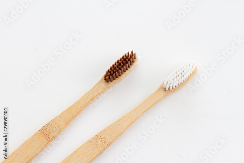 Natural bamboo  black and white   toothbrushes on white background