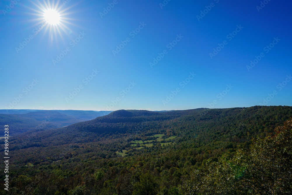 Overlook with sun star along scenic route 7 byway in Arkansas during autumn