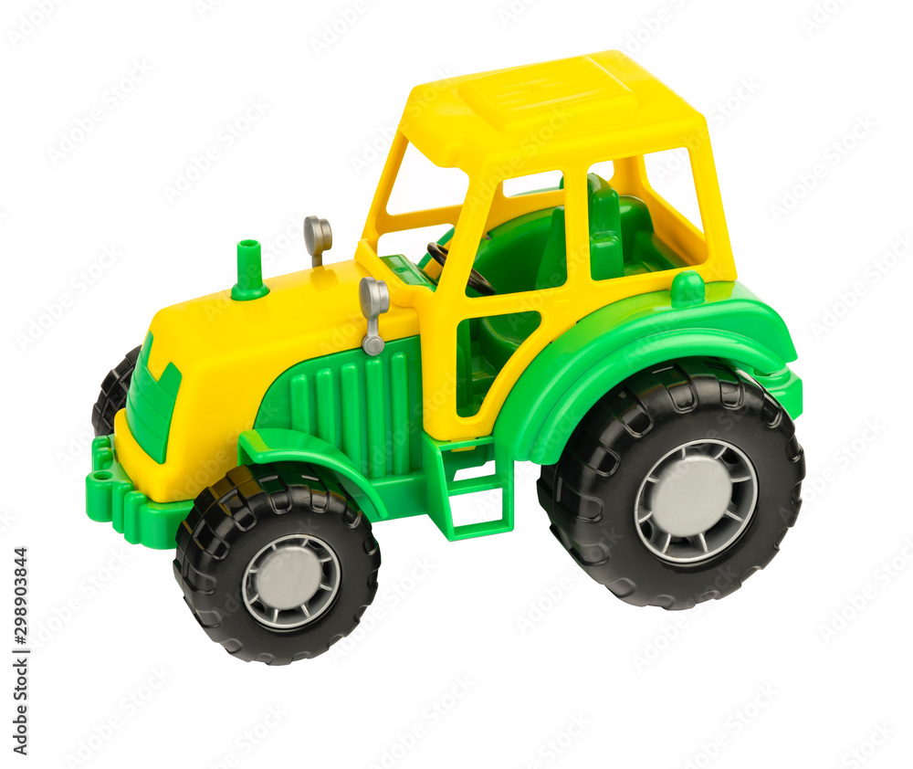 Green Tractor. Toy for children. Toy tractor on a white background. Green Tractor. Toy for children. Toy tractor on a white background.