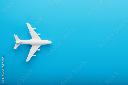 Passenger Model airplane on a blue background. Free space for text.