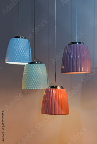 Multi-colored ceramic pendant lights, chandeliers of different colors but of the same type © Olha