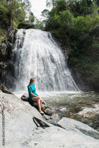 Woman at Korbu Waterfall on...
