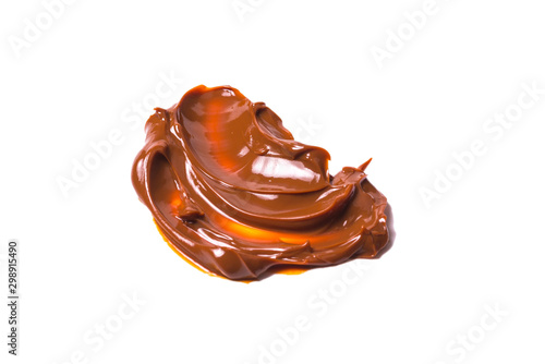 Melted tasty caramel splashes isolated on white background.