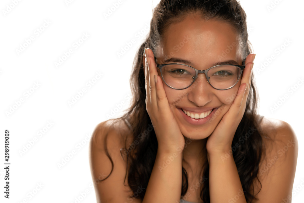 Happy young dark skinned woman with eyeglasses on white background