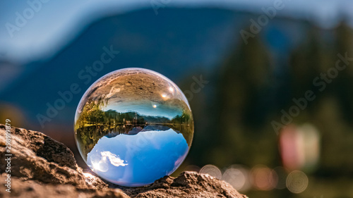 Crystal ball alpine landscape shot at the famous Pillersee, Tyrol, Austria © Martin Erdniss