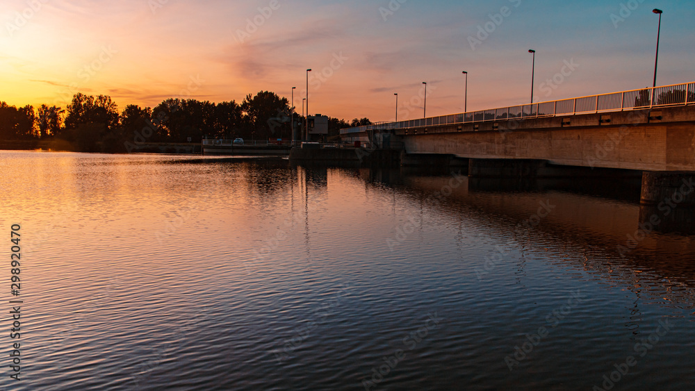 Beautiful sunset with reflections near Plattling, Isar, Bavaria, Germany