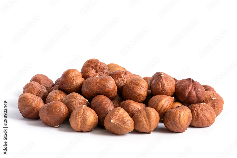 Hazelnuts without shell on a white background, isolated. Pile of hazelnut closeup. Hazelnuts without shell on a white background, isolated. Pile of hazelnut closeup.