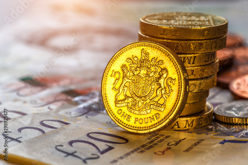 British coins stack on black, pound sterling,Business concept photo