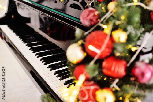piano keys close up on Christmas decor background. The Concept Of Christmas.