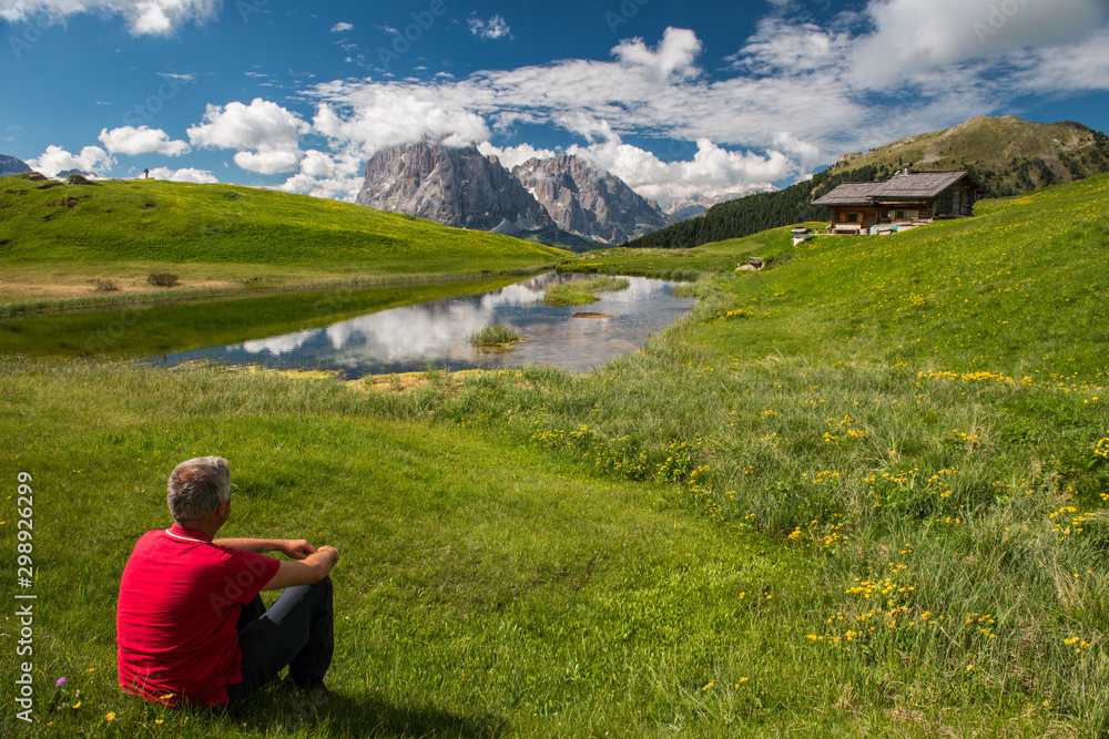 Man is relaxing in the Dolomites Man is relaxing in the Dolomites