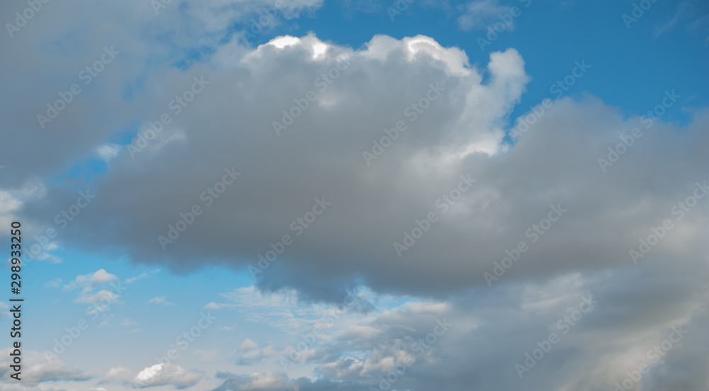 Fototapeta premium Cumulus clouds over the earth in late autumn
