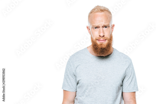 handsome bearded man looking sarcastic, isolated on white