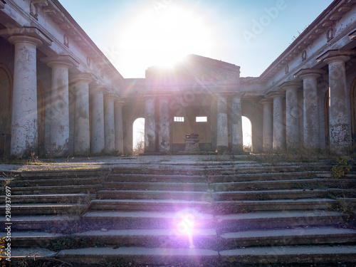 Halloween in cult place Mortuary or Pantheon. Ancient ruined building. Rites of Samhain, All Saints, Feast of Dead. parenterals. Natural effects of oncoming sunlight and lens flare. Halloween eve