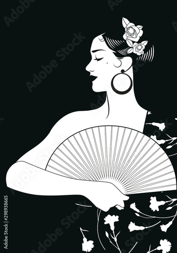 Beautiful Spanish woman with fan, wearing embroidered shawl of carnations and roses in her hair