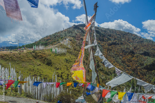 Thousands of white and colorful prayer flags hoisted on the route of Chele la pass