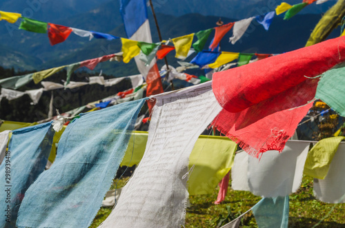 Many colorful prayer flags flapping the wind at Chele la pass in Bhutan photo