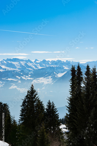 Fototapeta Naklejka Na Ścianę i Meble -  Majestic unique misty blue alpine skyline aerial view panorama of iced Swiss Alps and blue sky. Mount Rigi Switzerland.
