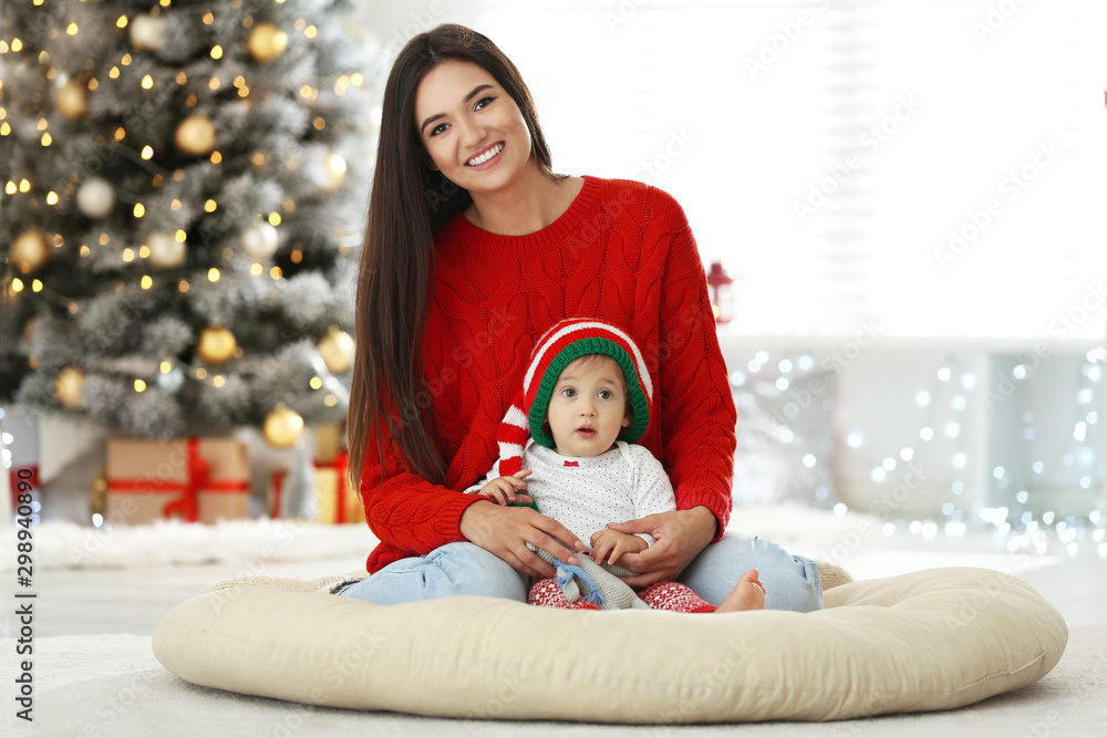 Mother and her cute baby at home. Christmas celebration Mother and her cute baby at home. Christmas celebration