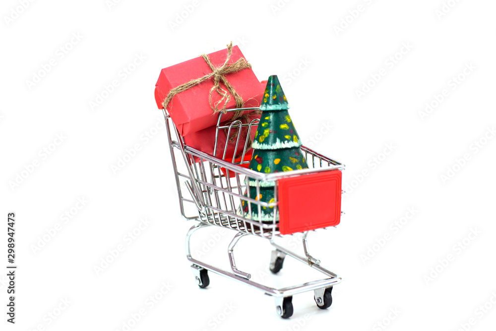 Christmas gifts in a supermarket trolley on white background. Black Friday and Cyber Monday Christmas gifts in a supermarket trolley on white background. Black Friday and Cyber Monday