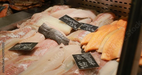 Raw delicious fresh seafood red slices on ice on market store shop