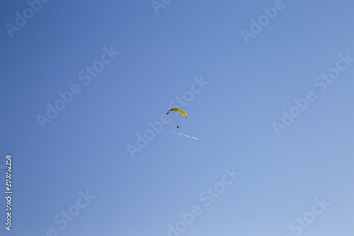 skydiver flies in the sky